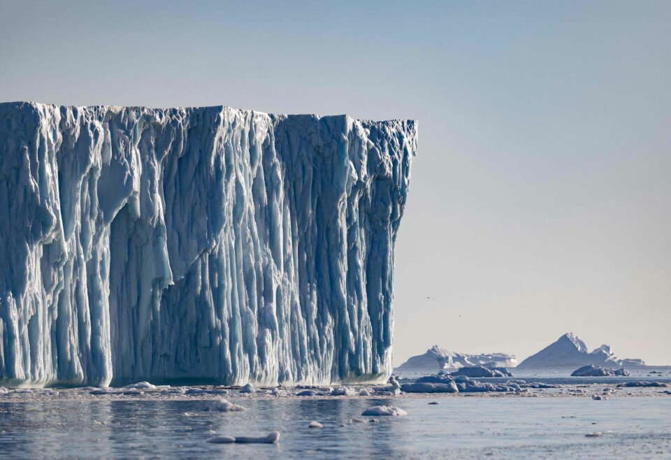 (FILES) In this file photo taken on June 30, 2022 an iceberg floats in Disko Bay, Ilulissat, western Greenland. - A growing number of tourists from around the world are flocking to Greenland to take in the Arctic island's  breathtaking icebergs, vast vistas and natural beauty. But authorities are now mulling ways of controlling crowd numbers in order to protect the fragile environment, already under threat from global warming. (Photo by Odd ANDERSEN / AFP)