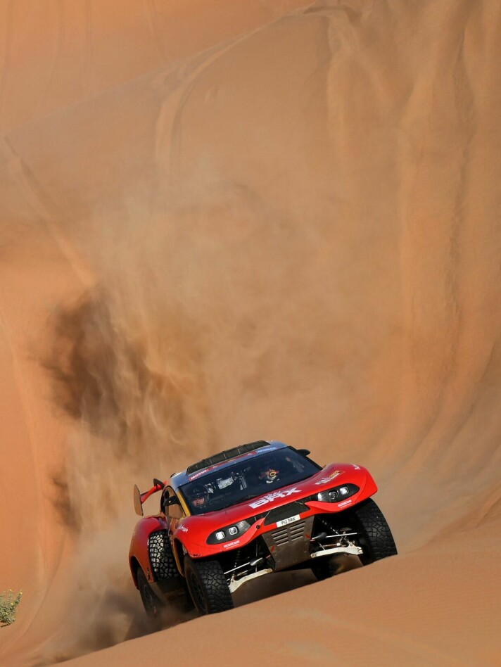 French driver Sebastien Loeb and Belgian co-driver Fabian Lurquin steer their BRX during the Stage 13 of the Dakar 2023 between Saybah and al-Hofuf, Saudi Arabia, on January 14, 2023. - Loeb won a record sixth successive stage in the Dakar Rally although barring a disaster Qatar's Nasser Al-Attiyah looks set for a fifth title. (Photo by FRANCK FIFE / AFP)