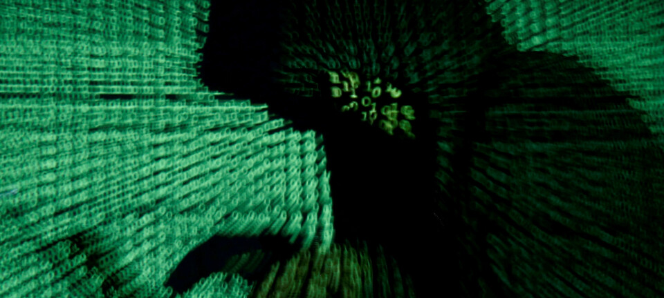 FILE PHOTO: A man holds a laptop computer as cyber code is projected on him in this illustration picture taken on May 13, 2017. Capitalizing on spying tools believed to have been developed by the U.S. National Security Agency, hackers staged a cyber assault with a self-spreading malware that has infected tens of thousands of computers in nearly 100 countries. REUTERS/Kacper Pempel//File Photo
