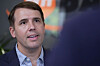 Close-up portrait of Chris Pappas speaking against a blurred backdrop in Salem, New Hampshire.